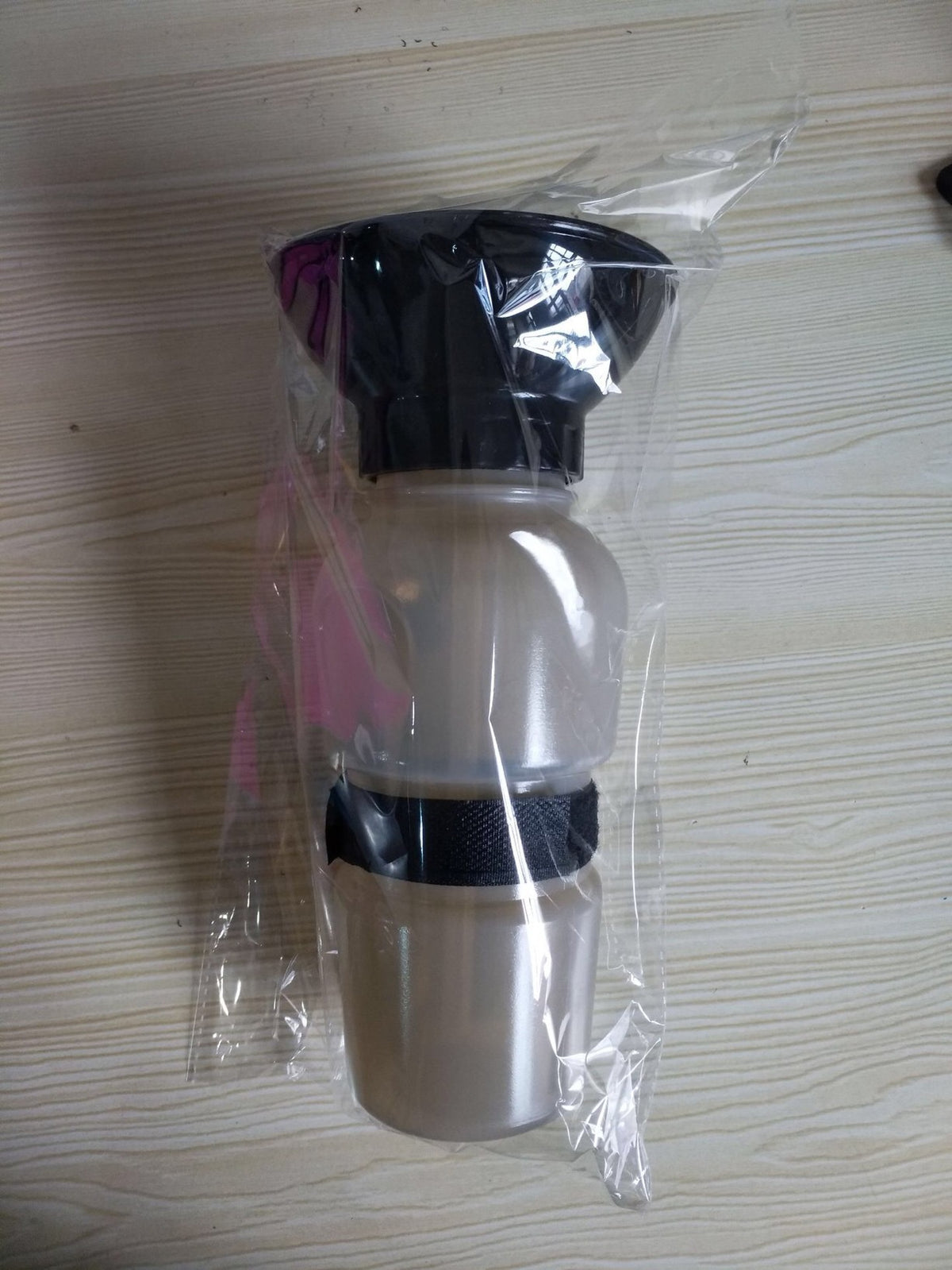 Portable dog water bottle with built-in bowl, view 4